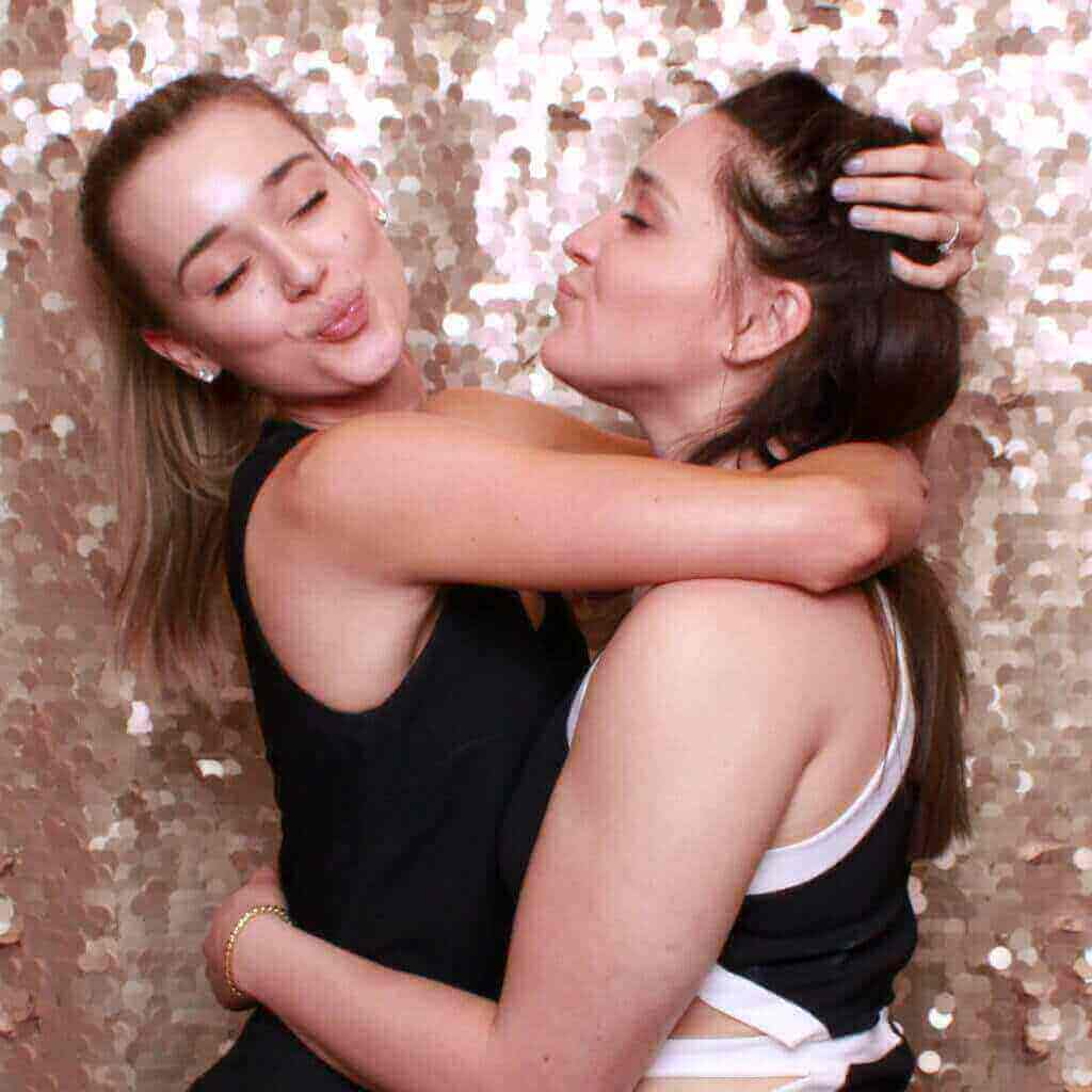 Friends hugging in the photo booth